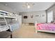Bedroom with bunkbeds, a queen bed, TV, and a ceiling fan at 170 Oakleigh Manor Dr, Fayetteville, GA 30215