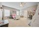 Spacious bedroom with carpet, ceiling fan, lots of natural light, and play space at 170 Oakleigh Manor Dr, Fayetteville, GA 30215