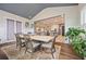 Open-concept dining room with views to the kitchen has access to the back patio at 170 Oakleigh Manor Dr, Fayetteville, GA 30215