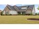 Beautiful home showcasing well-maintained landscaping and stylish architectural details at 170 Oakleigh Manor Dr, Fayetteville, GA 30215