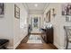 Inviting foyer with hardwood floors, a decorative rug, and coat closet at 170 Oakleigh Manor Dr, Fayetteville, GA 30215