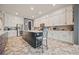 Bright kitchen features a large island, stainless steel appliances, and ample white cabinetry at 170 Oakleigh Manor Dr, Fayetteville, GA 30215
