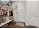 Practical mud room featuring a bench, coat hooks, shelving, and storage baskets at 170 Oakleigh Manor Dr, Fayetteville, GA 30215