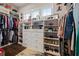 Walk-in closet offers ample shelving, drawers, and storage space for shoes and clothes at 170 Oakleigh Manor Dr, Fayetteville, GA 30215