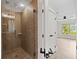 Modern bathroom featuring a tiled shower with glass door and tile surround at 220 Semel Cir # 150, Atlanta, GA 30309