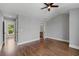 A spacious bedroom featuring hardwood floors and an open view to an ensuite bathroom at 220 Semel Cir # 150, Atlanta, GA 30309