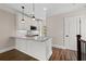 Modern kitchen with white cabinets, marble countertops, and stainless steel appliances at 220 Semel Cir # 150, Atlanta, GA 30309