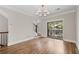 Spacious living room with hardwood floors and sliding glass doors to outdoor deck at 220 Semel Cir # 150, Atlanta, GA 30309