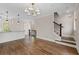 Open-concept living room with hardwood floors, stairs to the next level, and modern lighting at 220 Semel Cir # 150, Atlanta, GA 30309