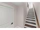 Bright staircase with hardwood steps and white risers, complemented by a contrasting handrail at 220 Semel Cir # 150, Atlanta, GA 30309