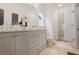 Bright bathroom with double vanity, glass shower, and tile flooring at 3272 Stillwood Dr, Atlanta, GA 30354