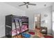 Bright bedroom featuring a bunkbed and view into the bathroom at 3272 Stillwood Dr, Atlanta, GA 30354