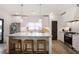 Bright kitchen with white cabinets, stainless steel appliances, a large island, and modern pendant lighting at 3272 Stillwood Dr, Atlanta, GA 30354