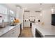 Bright kitchen with white cabinets, stainless steel appliances, and a large island with breakfast bar at 3272 Stillwood Dr, Atlanta, GA 30354