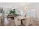 Bright living room with modern decor, hardwood floors, and a stylish dining area with a marble table at 3272 Stillwood Dr, Atlanta, GA 30354