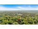 Aerial view captures the home nestled among trees, emphasizing the serene and private location with wooded surroundings at 4853 Ridgewood Creek Nw Dr, Acworth, GA 30102