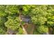 Aerial view showcases the home nestled among lush greenery, highlighting its private and serene setting at 4853 Ridgewood Creek Nw Dr, Acworth, GA 30102