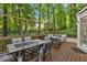 Outdoor deck area with seating, dining table, and string lights, perfect for outdoor entertaining at 4853 Ridgewood Creek Nw Dr, Acworth, GA 30102