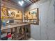 Basement workshop area featuring pegboard walls and a workbench with tool storage at 4853 Ridgewood Creek Nw Dr, Acworth, GA 30102