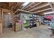 Spacious unfinished basement featuring concrete walls, storage shelving, and exposed ceiling at 4853 Ridgewood Creek Nw Dr, Acworth, GA 30102