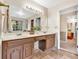 Bathroom features a double sink vanity, tile floors, and a view of the outside at 4853 Ridgewood Creek Nw Dr, Acworth, GA 30102
