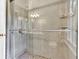 Bathroom features a walk-in shower with glass door and neutral-colored tiling at 4853 Ridgewood Creek Nw Dr, Acworth, GA 30102