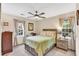 Comfortable bedroom features a ceiling fan and natural light from the windows at 4853 Ridgewood Creek Nw Dr, Acworth, GA 30102