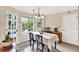 Sunny dining area with access to the patio and a traditional light fixture at 4853 Ridgewood Creek Nw Dr, Acworth, GA 30102