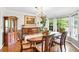 Bright dining room has a bay window, hardwood floors, and traditional furnishings at 4853 Ridgewood Creek Nw Dr, Acworth, GA 30102