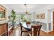 Elegant dining room features a chandelier, bay window, and hardwood floors at 4853 Ridgewood Creek Nw Dr, Acworth, GA 30102