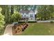 Charming two-story home with a landscaped yard, inviting front porch, and a classic picket fence at 4853 Ridgewood Creek Nw Dr, Acworth, GA 30102