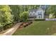Charming two-story home with a landscaped yard, inviting front porch, and a classic picket fence at 4853 Ridgewood Creek Nw Dr, Acworth, GA 30102