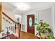 Bright foyer featuring hardwood floors, an elegant front door, and a stylish plant, creating a welcoming entrance at 4853 Ridgewood Creek Nw Dr, Acworth, GA 30102