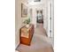 Inviting hallway with wood accent piece and artwork leading to a bright living area at 4853 Ridgewood Creek Nw Dr, Acworth, GA 30102