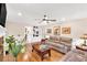 Inviting living room with hardwood floors, neutral paint, wainscoting, and comfortable seating at 4853 Ridgewood Creek Nw Dr, Acworth, GA 30102
