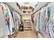 Spacious walk-in closet with custom shelving and ample storage space at 4853 Ridgewood Creek Nw Dr, Acworth, GA 30102