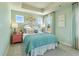 A bedroom with a tray ceiling, ample natural light, and comfortable decor at 518 Provence Gate Ln, Lawrenceville, GA 30044