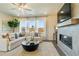 Inviting living room features a fireplace, large windows, and comfortable seating at 518 Provence Gate Ln, Lawrenceville, GA 30044