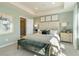 Spacious main bedroom featuring soft green walls, tray ceilings, and abundant natural light at 518 Provence Gate Ln, Lawrenceville, GA 30044