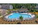 Community pool with lounge chairs, umbrellas and a covered area with seating at 518 Provence Gate Ln, Lawrenceville, GA 30044