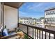 Balcony seating area with exterior views of the community and blue sky at 2669 Caruso Way, Atlanta, GA 30339