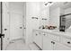 Modern bathroom features double sinks, elegant fixtures, and stylish marble floors at 2669 Caruso Way, Atlanta, GA 30339