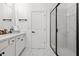 Modern bathroom features double sinks, elegant fixtures, and glass shower at 2669 Caruso Way, Atlanta, GA 30339
