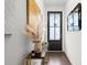 Close-up of the entryway featuring decorative accents, a modern console table, and a black front door at 2669 Caruso Way, Atlanta, GA 30339