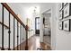 Inviting entryway with hardwood floors, stylish decor, and an open view to a study with contemporary accents at 2669 Caruso Way, Atlanta, GA 30339