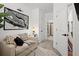 Bright hallway with a cozy seating area and a view into a modern bathroom with a glass-enclosed shower at 2669 Caruso Way, Atlanta, GA 30339