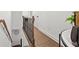 Hallway with hardwood floors and elegant staircase with a clock on the wall at 2669 Caruso Way, Atlanta, GA 30339