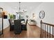 Stylish living room featuring hardwood floors, a dining area, and comfortable seating for modern living at 2669 Caruso Way, Atlanta, GA 30339
