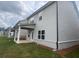 Exterior view of a home featuring a covered patio, neat landscaping, and siding at 4534 Eastbrook Pl, Snellville, GA 30039