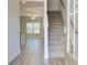Open entryway with hardwood floors and staircase to the upper level at 4534 Eastbrook Pl, Snellville, GA 30039